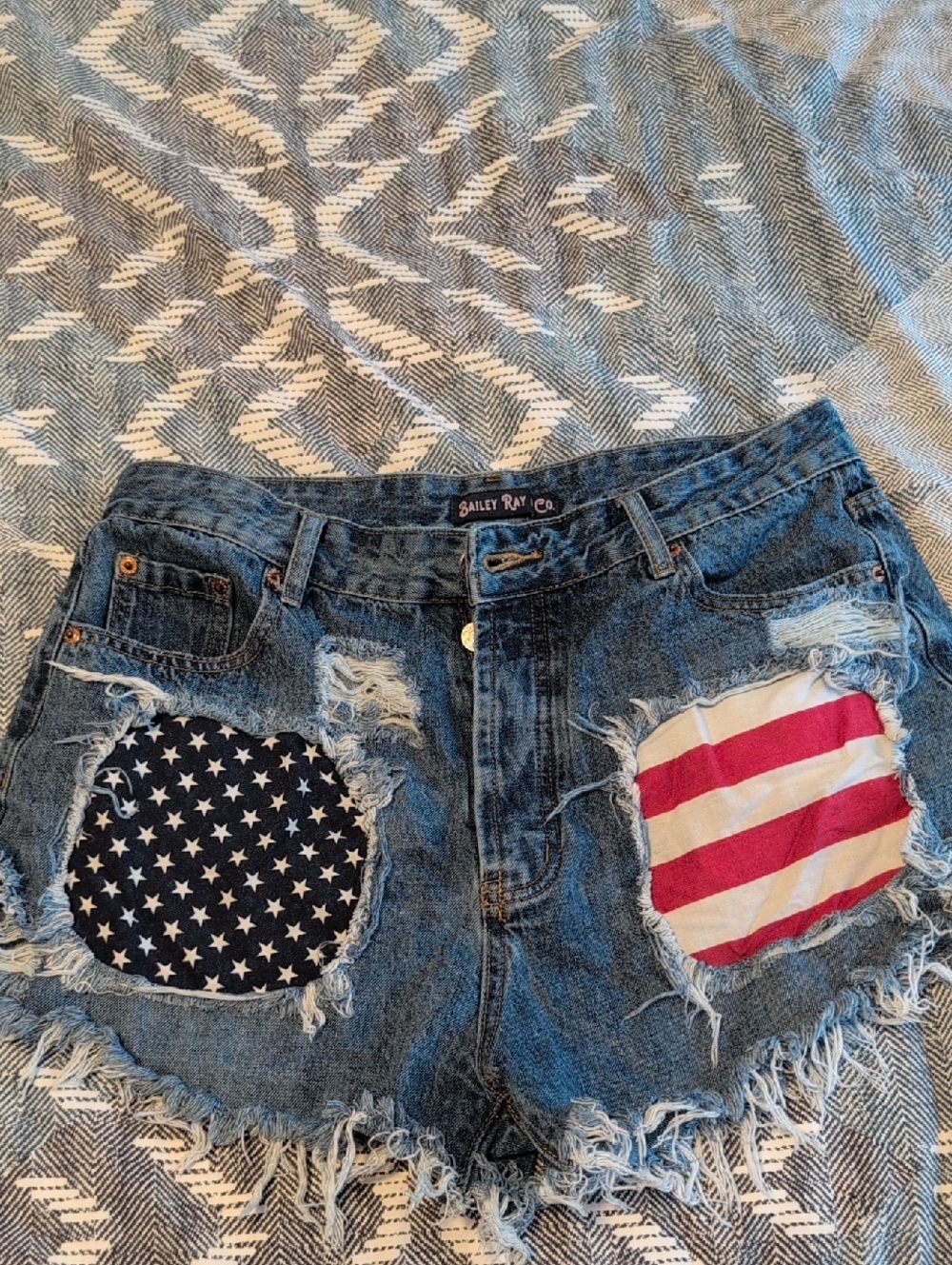 Bailey Ray & Co Blue Denim Cutoff Shorts with Red & White Flag Patches